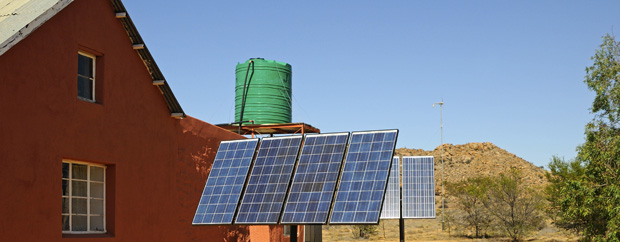Solar panels in front of rural buildings